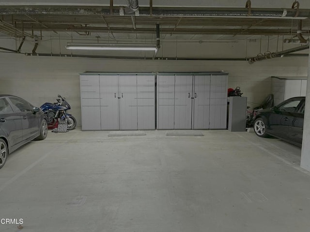 parking garage featuring concrete block wall
