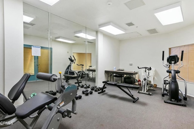 gym with visible vents and baseboards