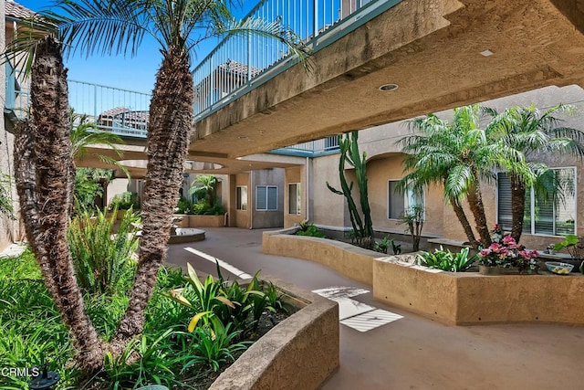 view of home's community featuring a patio area