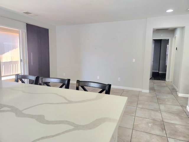 dining room with light tile patterned floors