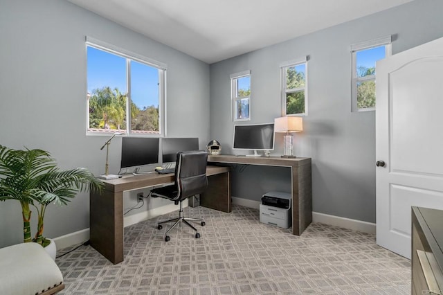 office space with baseboards