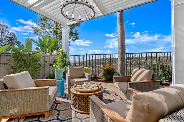 view of patio with an outdoor hangout area and fence