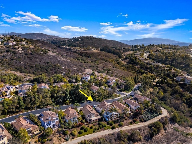 drone / aerial view with a residential view and a mountain view