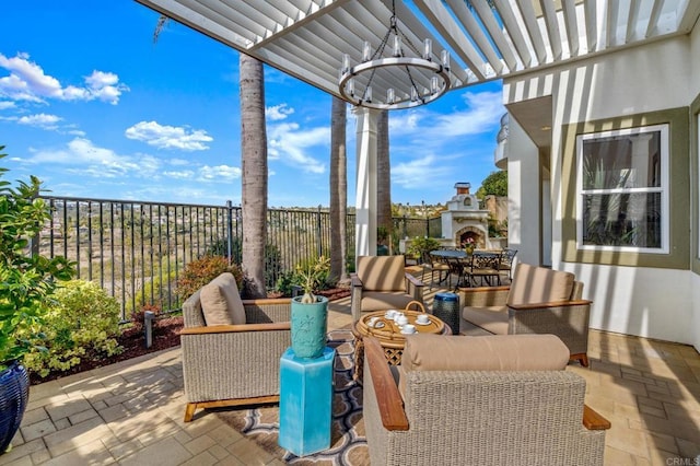 view of patio featuring fence, a pergola, and an outdoor living space with a fireplace
