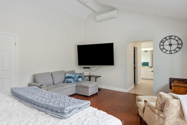 living room featuring a wall mounted air conditioner, lofted ceiling with beams, and hardwood / wood-style floors