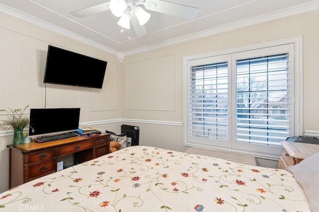 bedroom with ornamental molding and ceiling fan