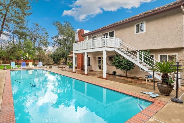 view of pool featuring a patio