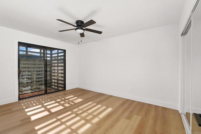 unfurnished bedroom with light hardwood / wood-style flooring, a closet, and ceiling fan