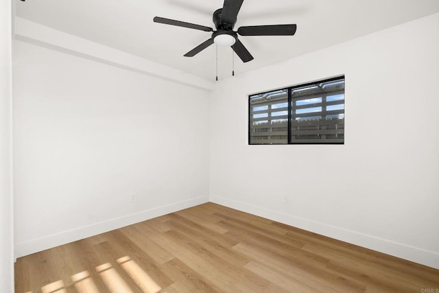 empty room with wood-type flooring and ceiling fan