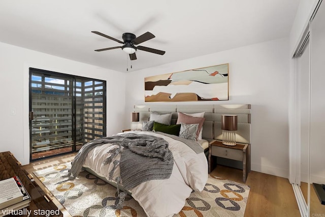 bedroom featuring light hardwood / wood-style flooring, a closet, and ceiling fan