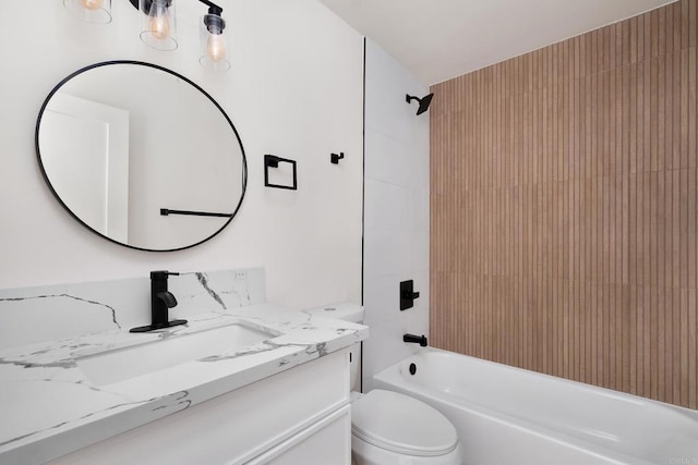 full bathroom with vanity, toilet, and tiled shower / bath combo