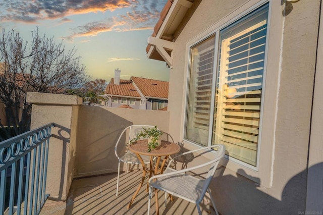 view of balcony at dusk