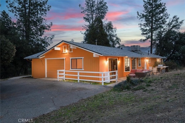 ranch-style home with a garage