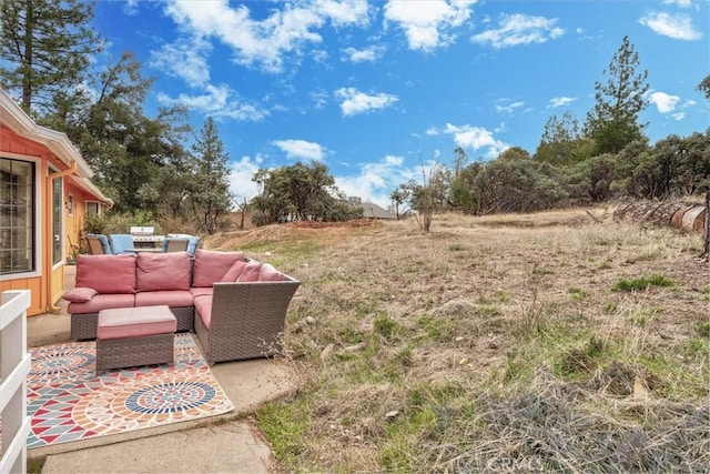 view of yard with an outdoor hangout area and a patio