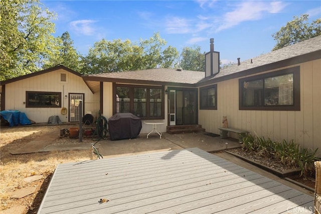 wooden deck featuring grilling area