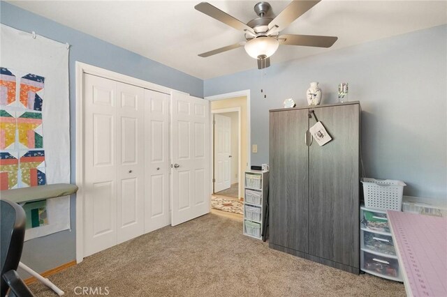 office area with light carpet and ceiling fan