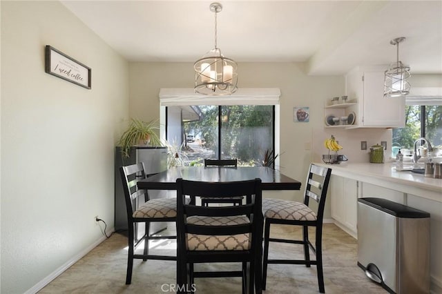 dining space with an inviting chandelier