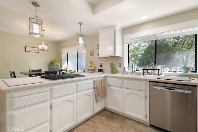 5045 Malibu Dr, Paradise, CA 95969 - kitchen with stainless steel appliances, a peninsula, plenty of natural light, and white cabinets
