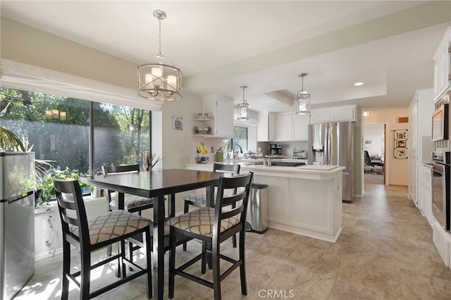 5045 Malibu Dr, Paradise, CA 95969 - dining room featuring a raised ceiling and a chandelier