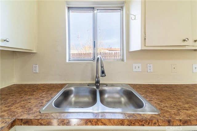 kitchen with sink and white cabinets