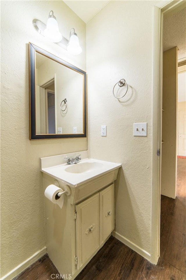 bathroom with wood-type flooring and vanity