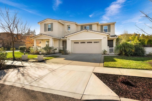 view of property with a garage and a front lawn