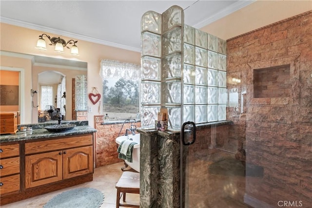 bathroom with crown molding, tile patterned floors, vanity, and a shower with door