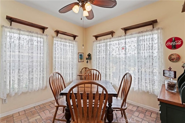 dining room featuring ceiling fan