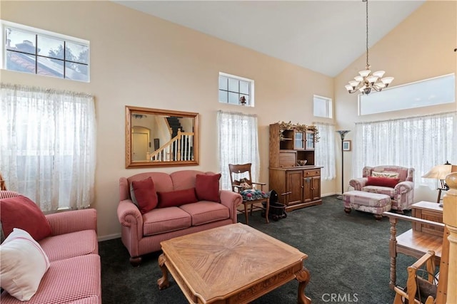 living room featuring high vaulted ceiling, an inviting chandelier, and dark carpet