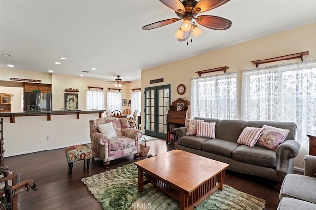 living room featuring french doors, ceiling fan, and dark hardwood / wood-style flooring