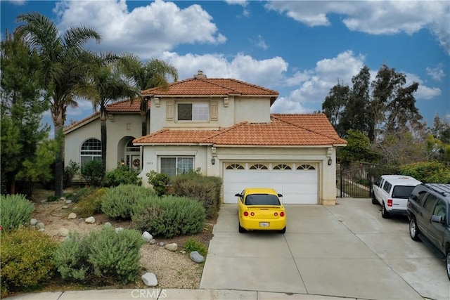 mediterranean / spanish house featuring a garage