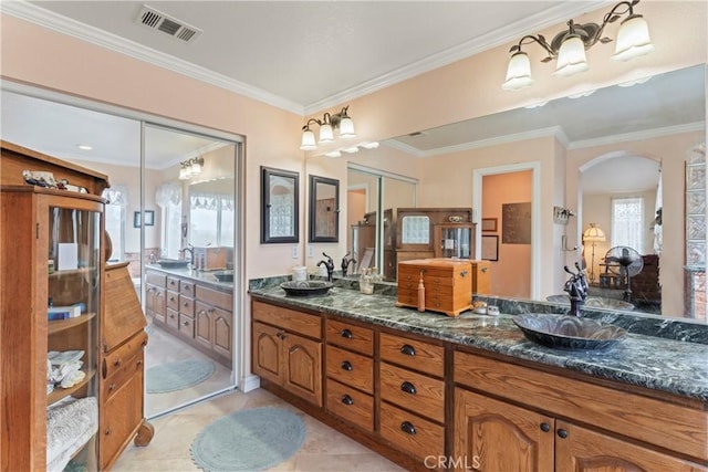 bathroom with vanity, tile patterned floors, and ornamental molding