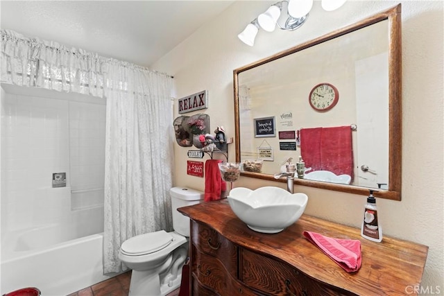 full bathroom with toilet, vanity, and shower / bathtub combination with curtain