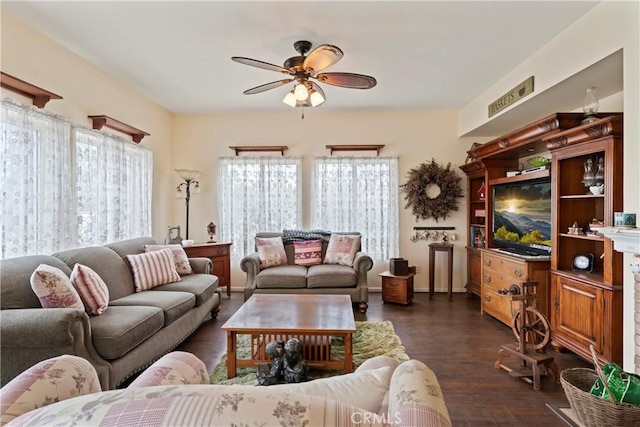 living room with dark hardwood / wood-style floors and ceiling fan