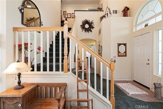 entryway with a high ceiling