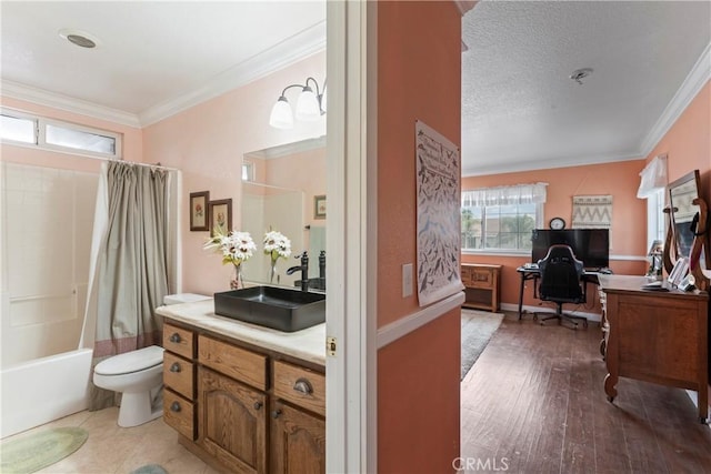 full bathroom featuring shower / tub combo with curtain, hardwood / wood-style flooring, vanity, ornamental molding, and toilet