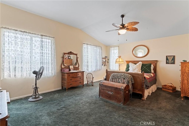 carpeted bedroom with vaulted ceiling and ceiling fan