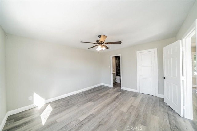 unfurnished bedroom featuring light hardwood / wood-style floors, a closet, and ceiling fan