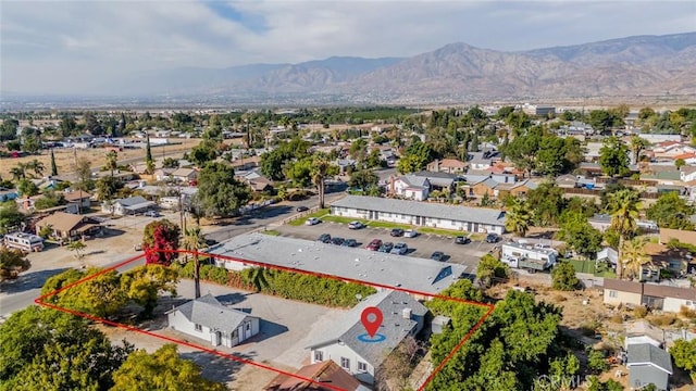 birds eye view of property with a mountain view