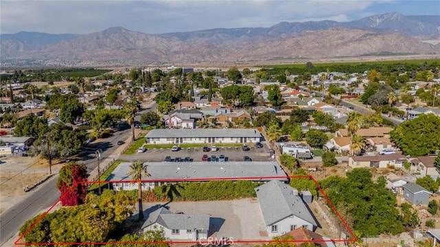 birds eye view of property featuring a mountain view