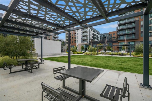 surrounding community featuring a pergola, a yard, and a patio