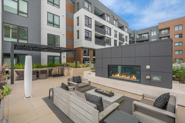 view of patio featuring a tiled fireplace