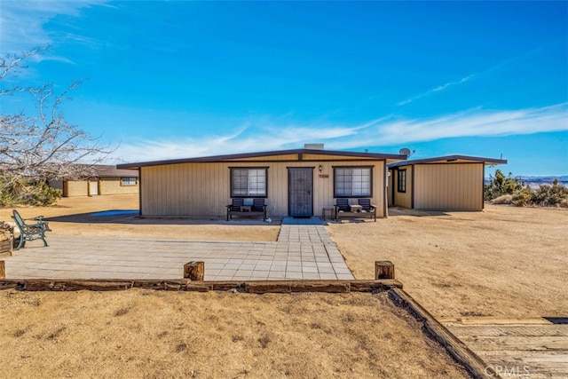 ranch-style house featuring a patio