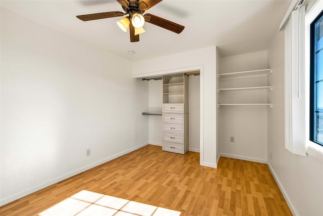 unfurnished bedroom featuring light hardwood / wood-style floors, a closet, and ceiling fan