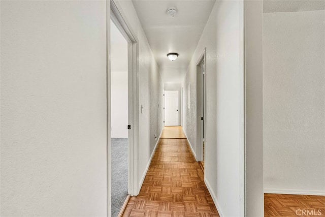 corridor featuring light parquet flooring