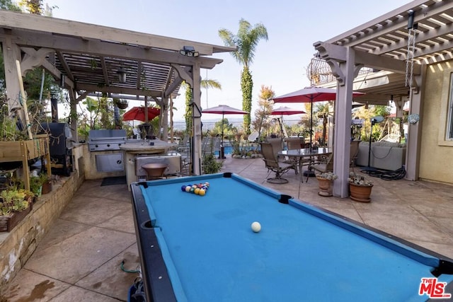 view of patio / terrace featuring grilling area and a pergola