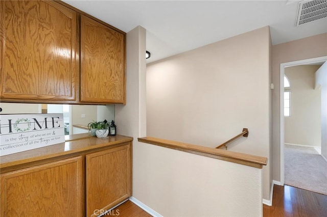 kitchen with dark wood-type flooring