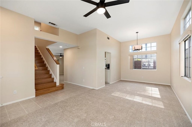 carpeted empty room with ceiling fan