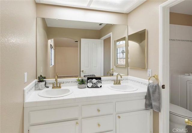 bathroom with vanity and toilet