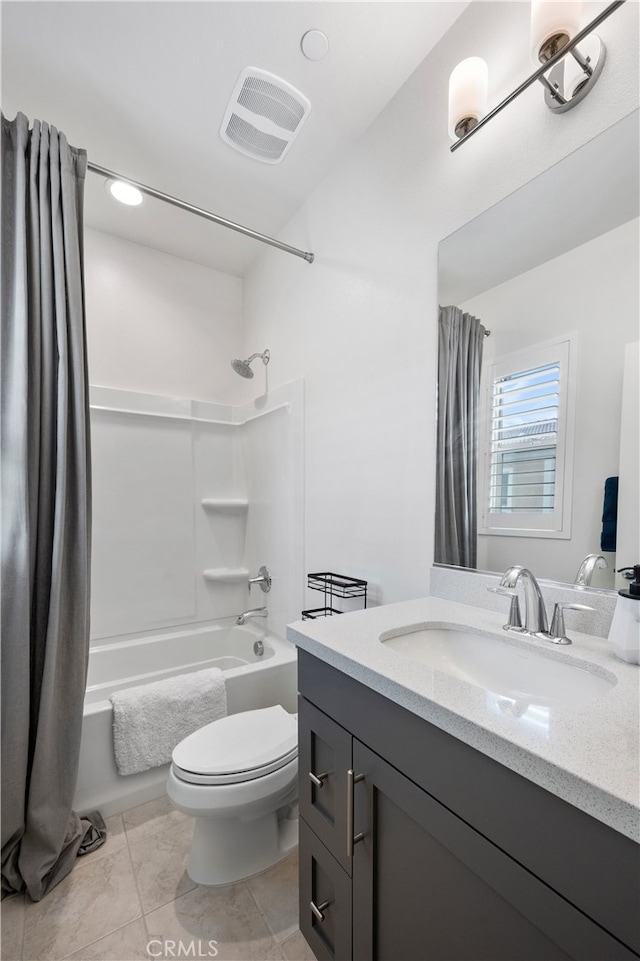 full bathroom featuring vanity, toilet, tile patterned flooring, and shower / tub combo